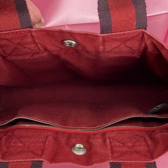 Hermès Fourre Tout PM tote bag in red canvas with black and red striped handles - Picture 11 of 15